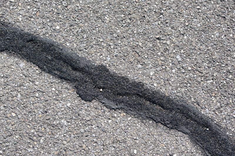 Cracked Asphalt Before Sealings